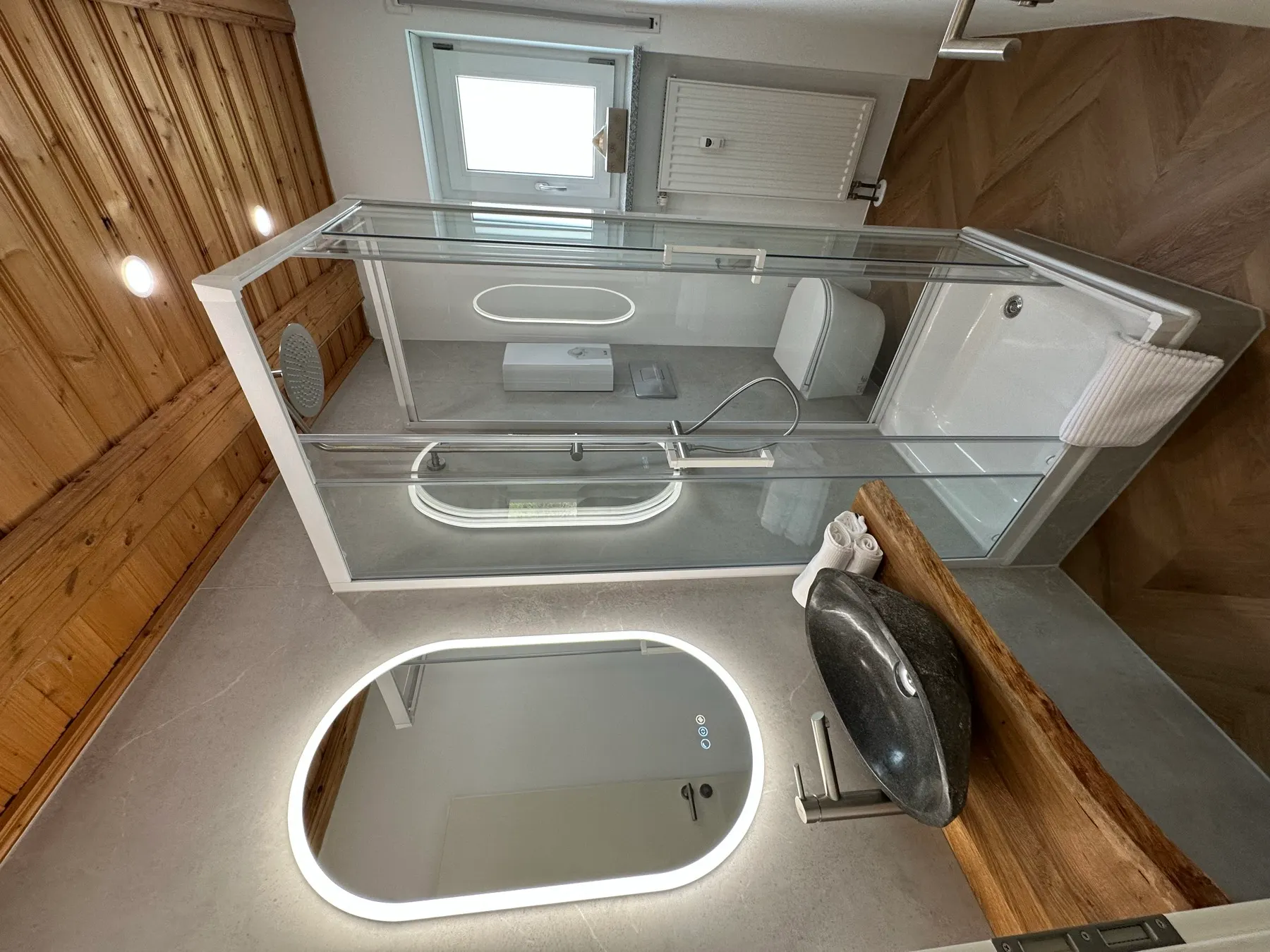 Apartment B7 – Bathroom with natural stone washbasin & wooden ceiling
