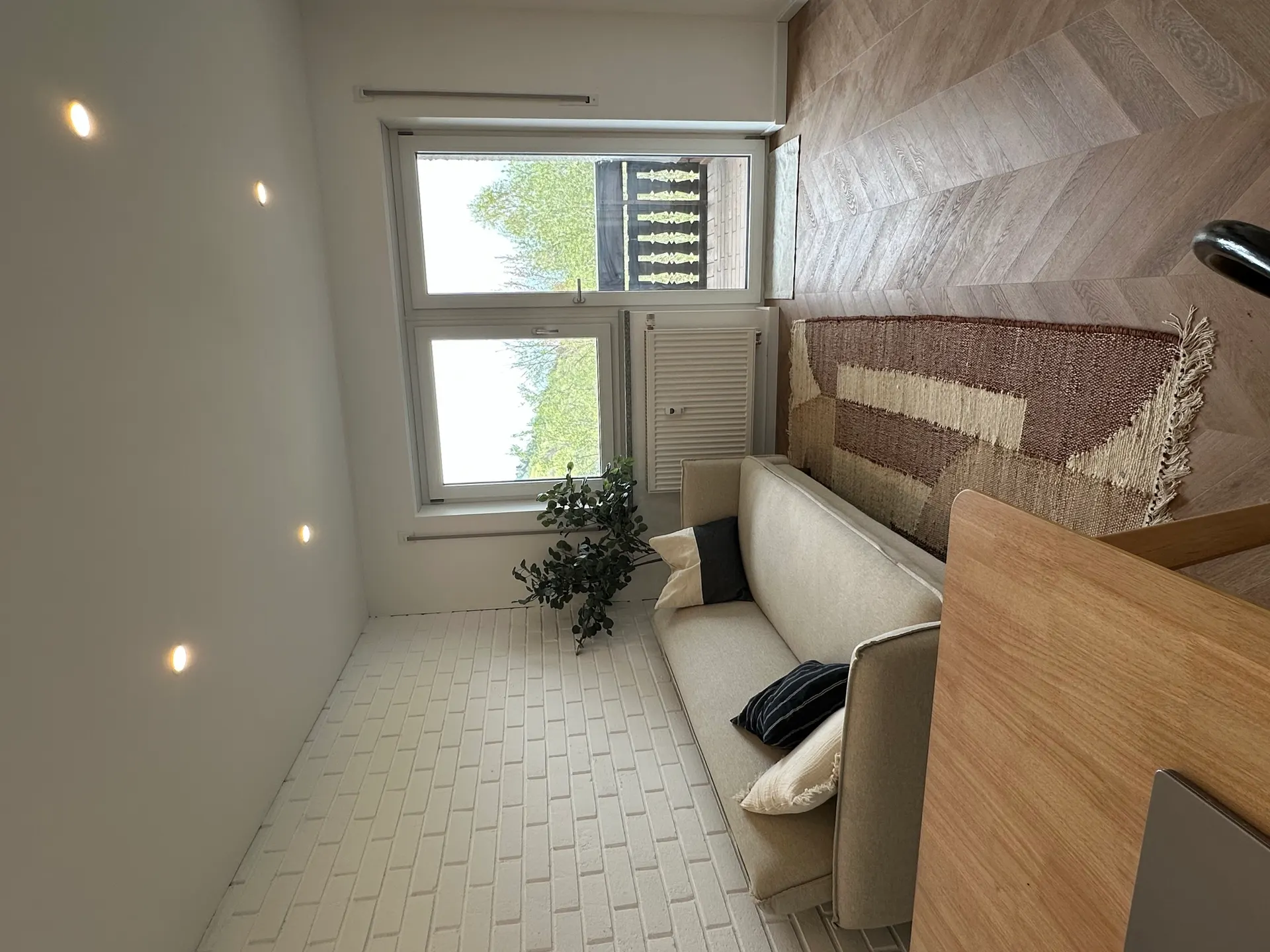 Apartment B7 – Living room with balcony access & forest views